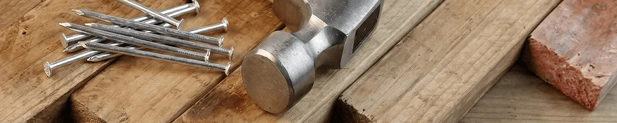 Hammer and nails on hardwood flooring boards in Chattanooga, TN