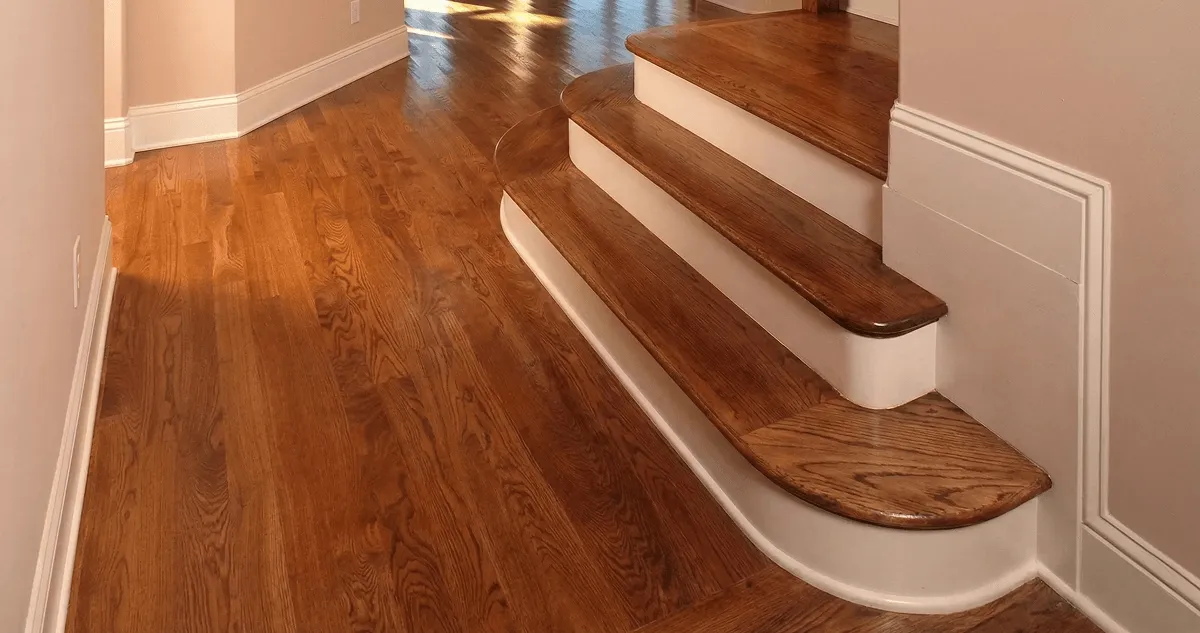 Base floor of a staircase with professionally restored wood flooring in Chattanooga TN