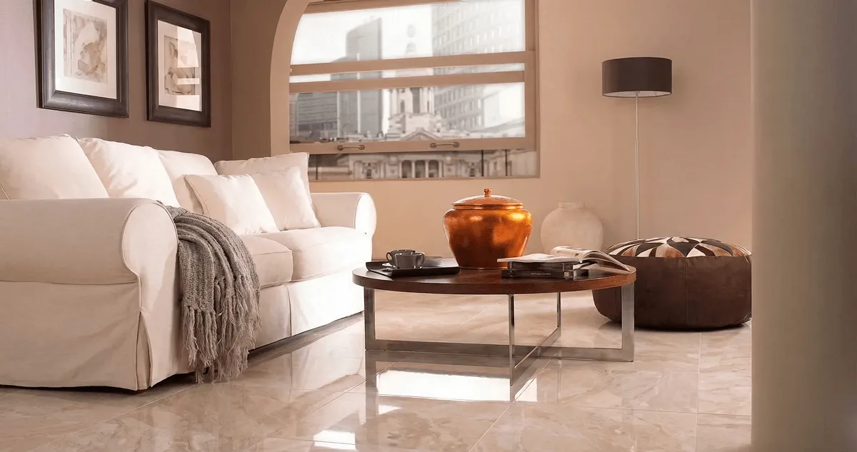 Modern living room with professionally installed marble flooring, a beige sofa, coffee table in Chattanooga, TN
