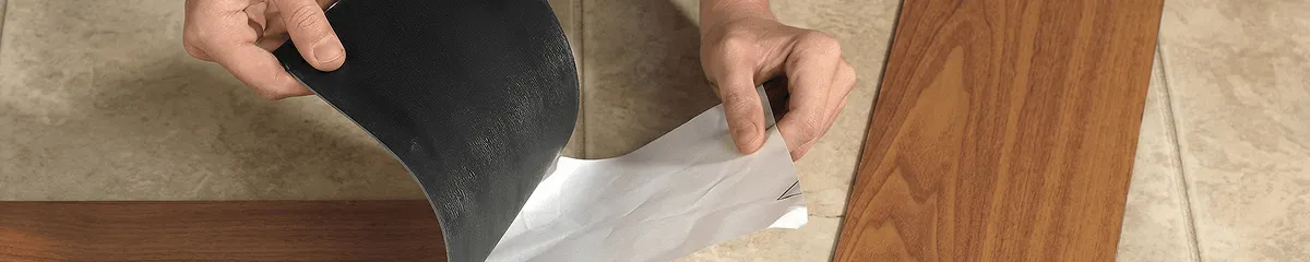 A professional installing vinyl flooring in Chattanooga, TN