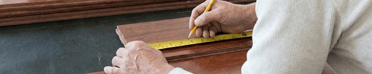 A professional installing wood flooring in Chattanooga, TN